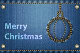 Christmas greetings on blue jeans background