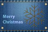 Christmas greetings on blue jeans background