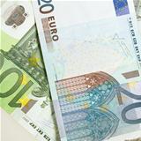 Euro banknotes arranged in background