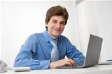 young confident business man with laptop
