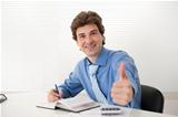 businessman showing thumbs up gesture