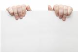 The two hands holding light grey cardboard paper