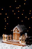 Gingerbread house under starry sky