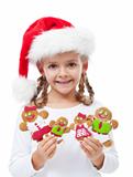 Happy little girl with gingerbread people family