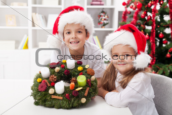 Kids holding advent wreath
