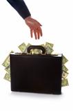 businessman reaching for a briefcase full of money
