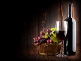 Wine on the dark wooden background