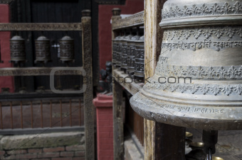 bell and prayer wheels in nepal