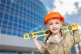 Adorable Child Boy Dressed Up as a Handyman in Front of Corporate Building.