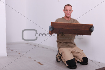 Man laying parquet floor