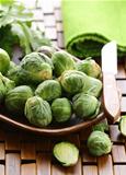 fresh raw brussels sprouts on a wooden table