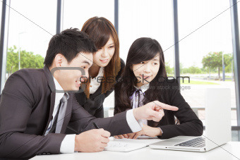 happy asian business team working in office