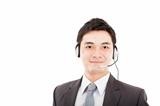 handsome businessman wearing headset and smiling isolated on whi