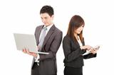 businessman and businesswoman using laptop and tablet pc