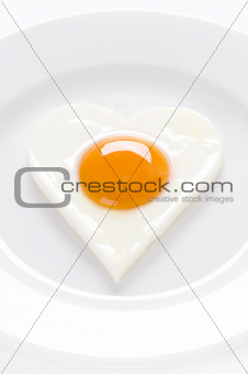 heart shaped egg on a plate