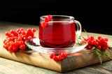 Cup of tea and viburnum berries.