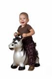 Child on an inflatable horse (white background)