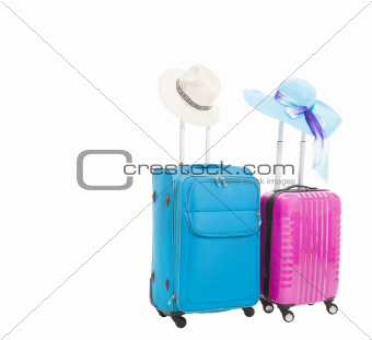 two travel case with hats isolated on white