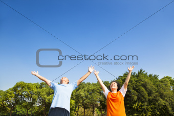 relaxed asian mature couple looking sky