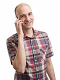 smiling young man talking on cell phone