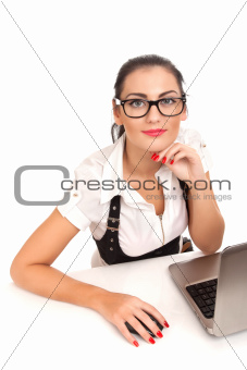 Portrait of business woman sitting on her desk