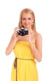 Portrait of young woman with vintage camera