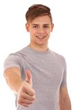 Young man going thumb up.