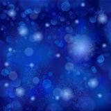 Beautiful soft blue snowflake background with bokeh lights