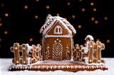 Gingerbread cookie house on dark background