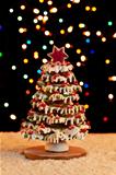 Gingerbread christmas tree with blurry lights