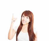 young asian Woman smiling and pointing up