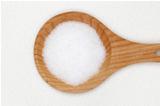 Sugar on a wooden spoon