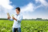 asian farmer with tablet pc