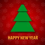 Green paper Christmas tree on red background