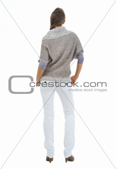 Woman in sweater. Rear view
