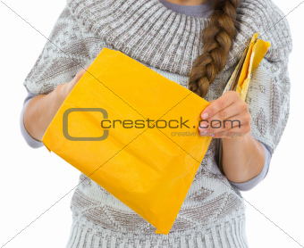 Closeup on woman opening letter