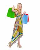 Smiling girl in dress with shopping bags