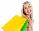 Portrait of smiling teenage girl with shopping bags