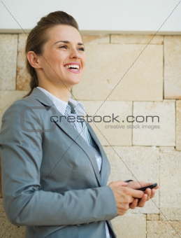 Portrait of happy business woman looking into distance