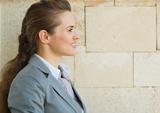 Profile portrait of happy business woman looking on copy space