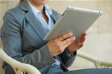Closeup on business woman using tablet PC