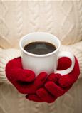 Woman in Sweater with Seasonal Red Mittens Holding a Warm Cup of Coffee.