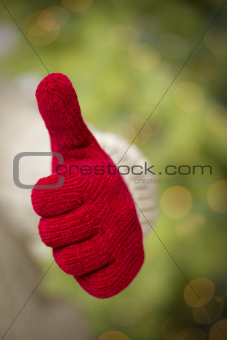 Woman in Sweater with Seasonal Red Mittens Holding Out a Thumb Up Sign with Her Hand.