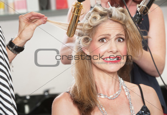 Anxious Woman with Hair Stylists
