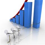 Business team putting in place column of rising graph