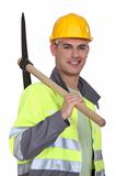 Tradesman carrying a pickaxe