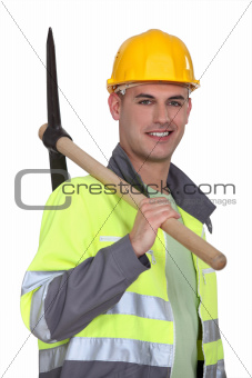 Tradesman carrying a pickaxe