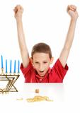 Boy Playing Dreidel on Hanukkah
