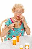 Healthy Senior Woman Takes Medication