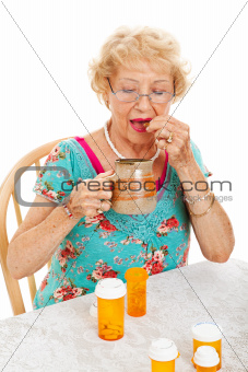 Healthy Senior Woman Takes Medication